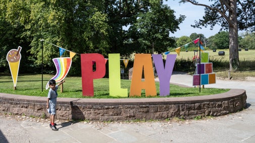 Giant, multi-coloured letters that spell out play